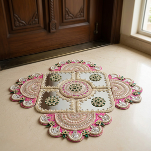 Royal Pink Mirrorwork Rangoli on the floor in front of a door